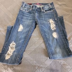 Rock and roll cowgirl low rise jeans.